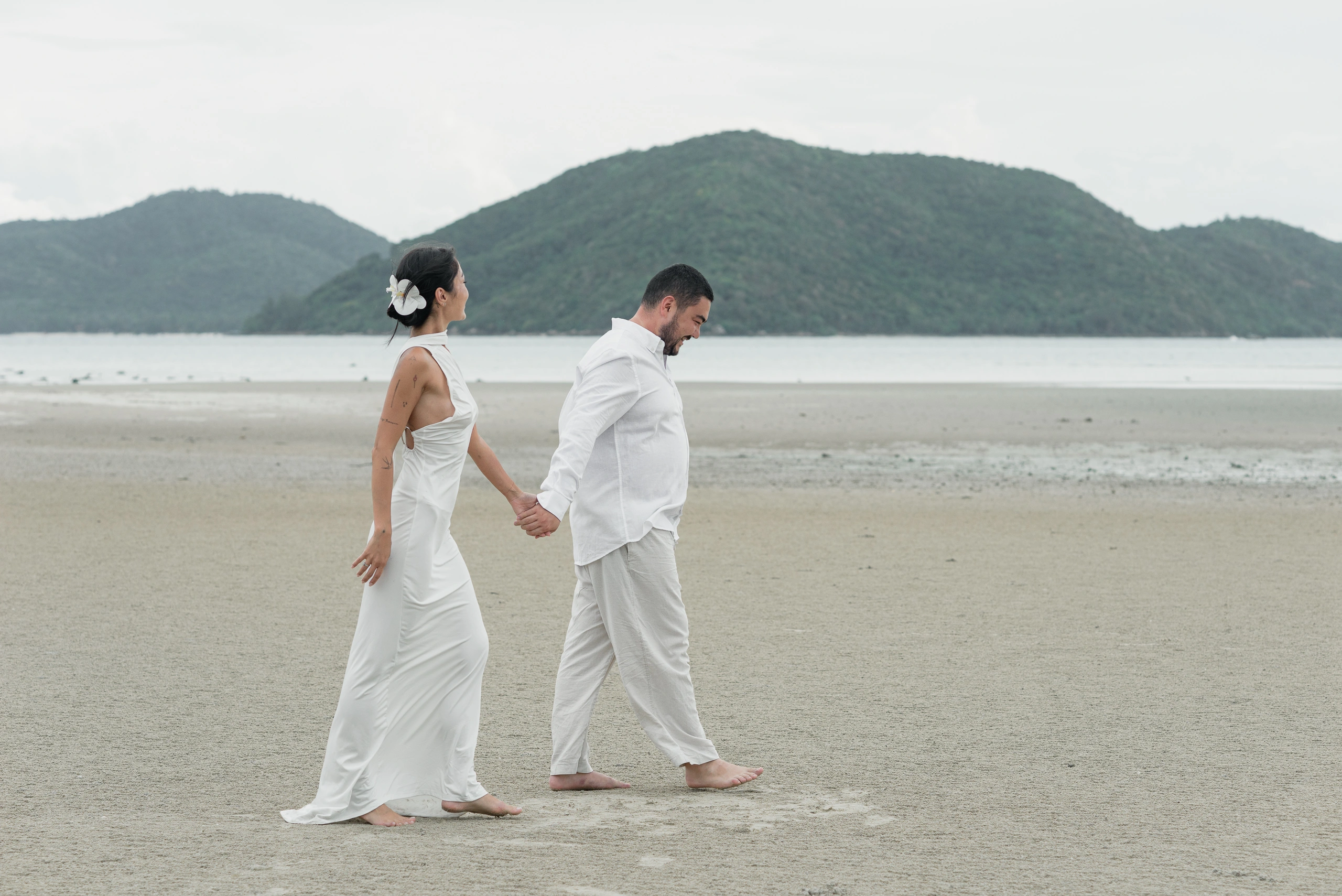 Couple walking together on a quiet beach