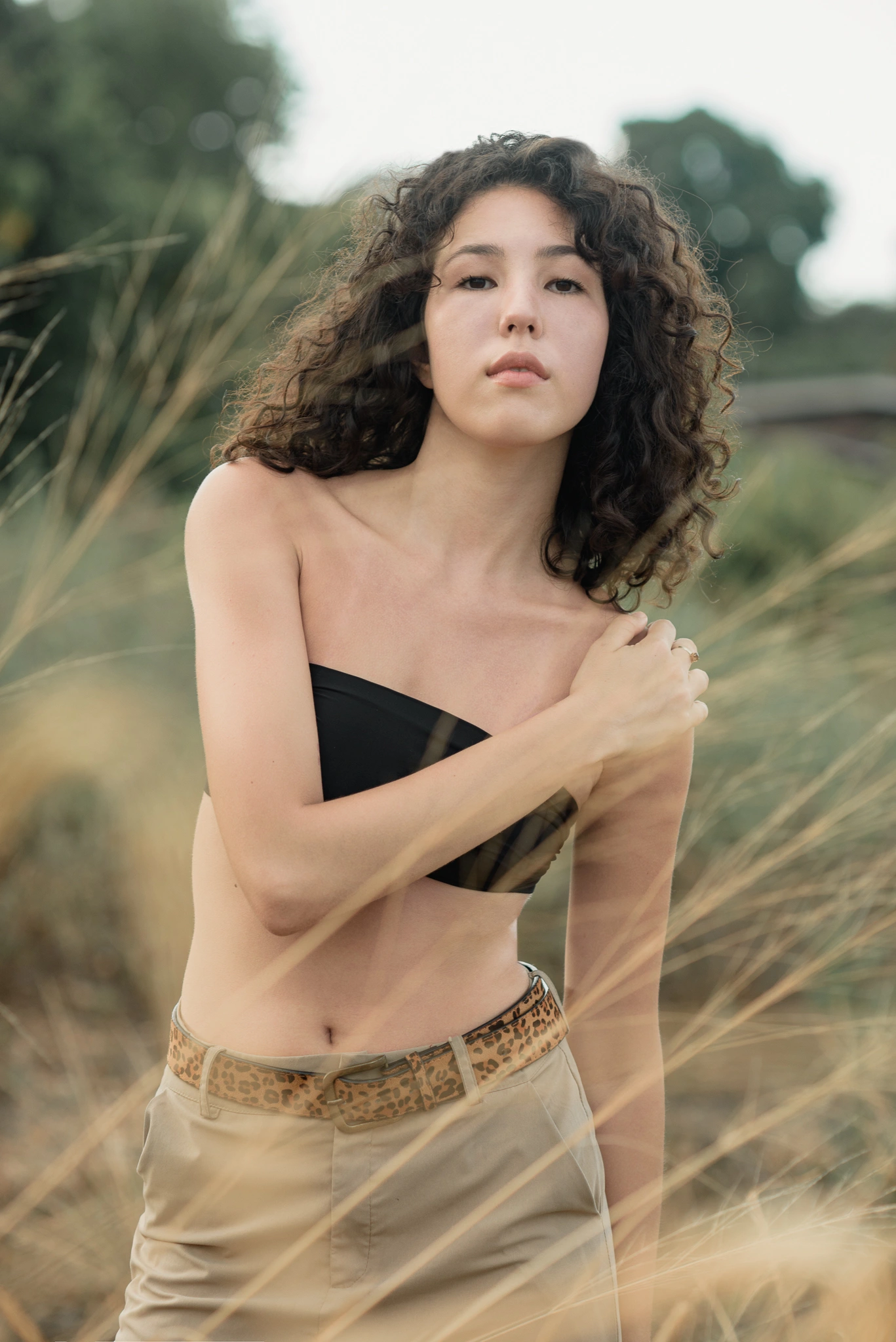 Close outdoor fashion portrait in soft natural light