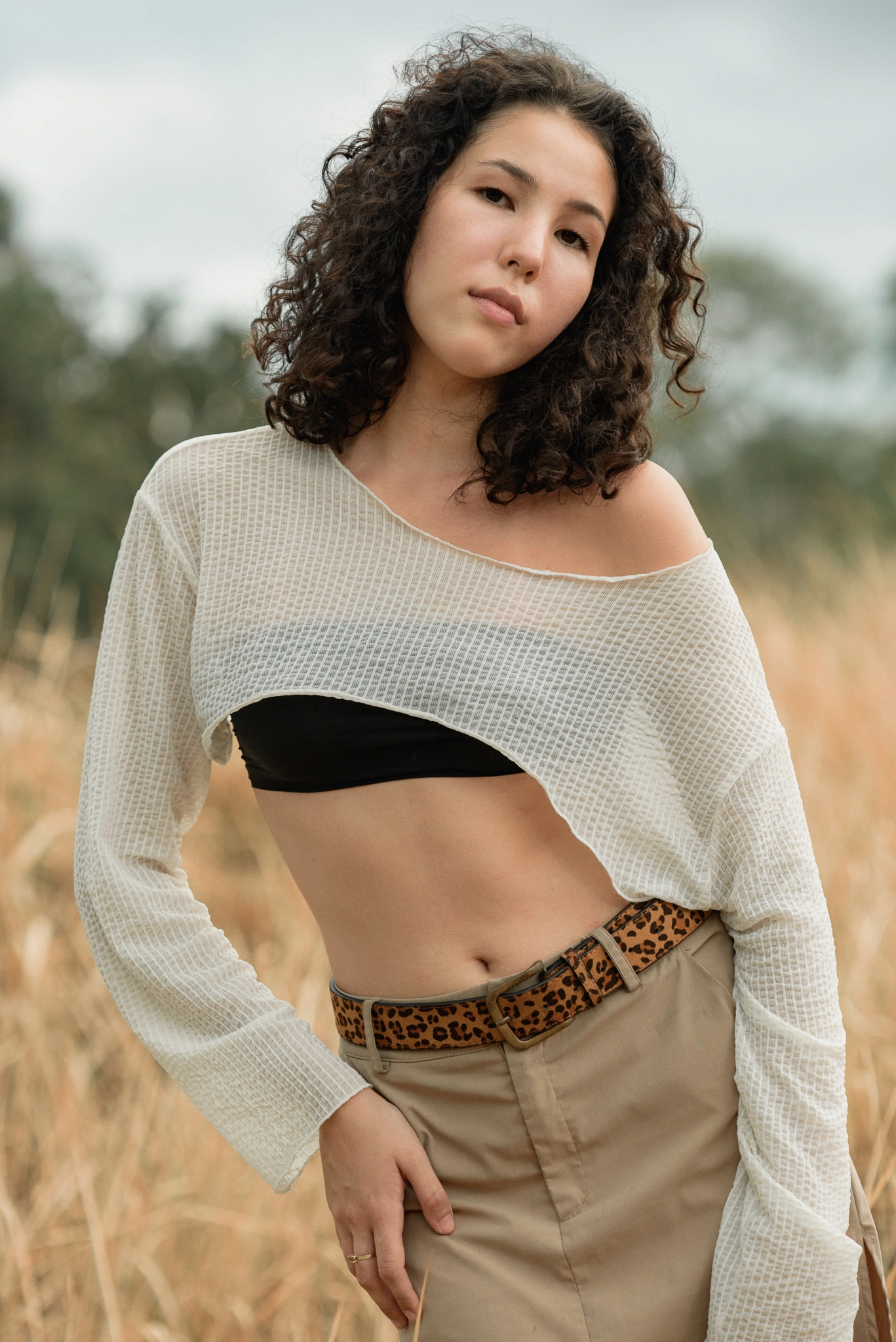 Close fashion portrait in a sheer white layer